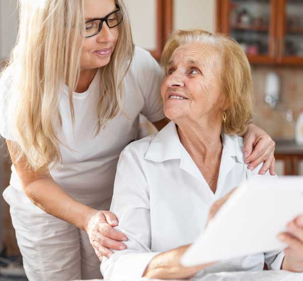 Elderly woman talking with daughter